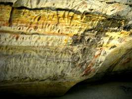 Carnarvon Gorge artwork wall of one thousand vulvas hands engraved stencilled