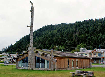 Skidegate totem pole and building