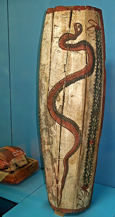 painted mummy in shroud snake coffin